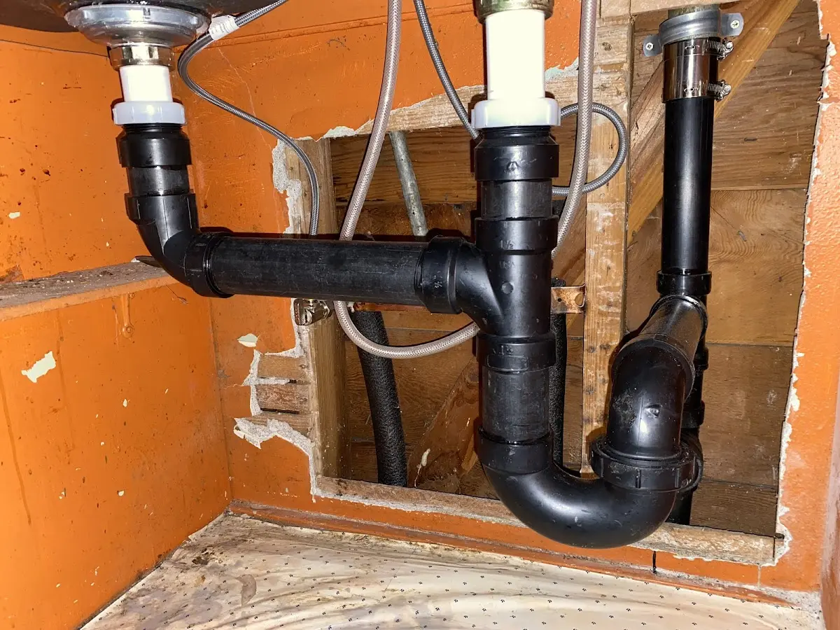 Professional Garbage Disposal Repair equipment and tools on the job in Denville